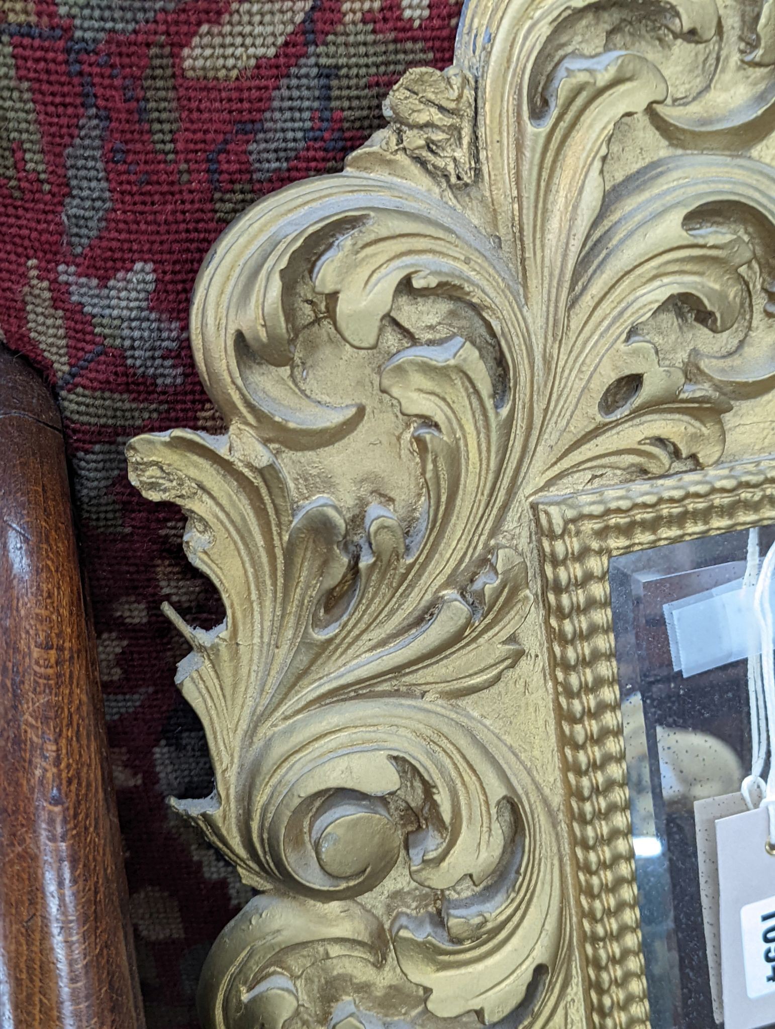 A small Florentine style gilt plaster acanthus scroll wall mirror, width 38cm, height 53cm